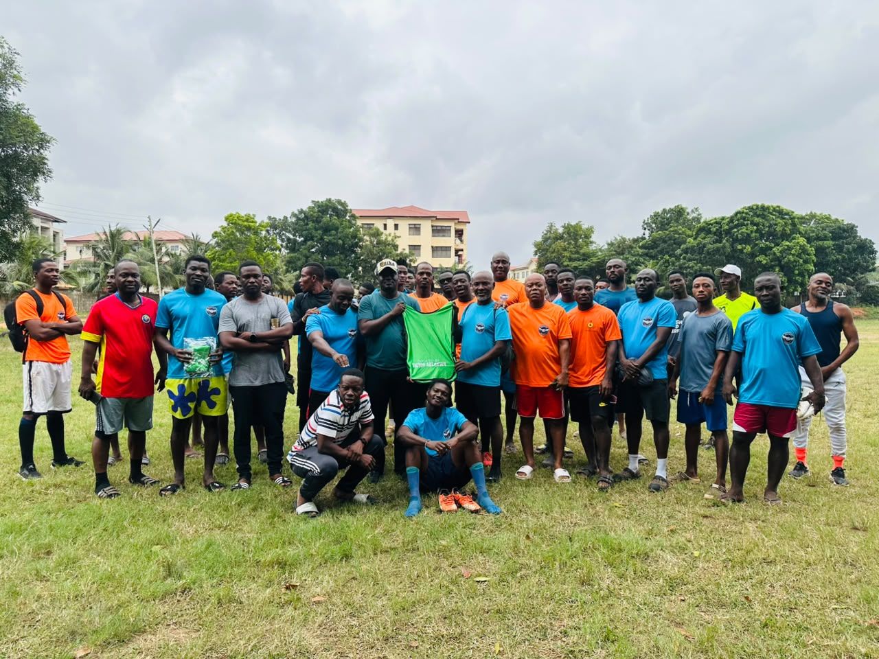 A club squad with the AD SPORTS team after a kit donation